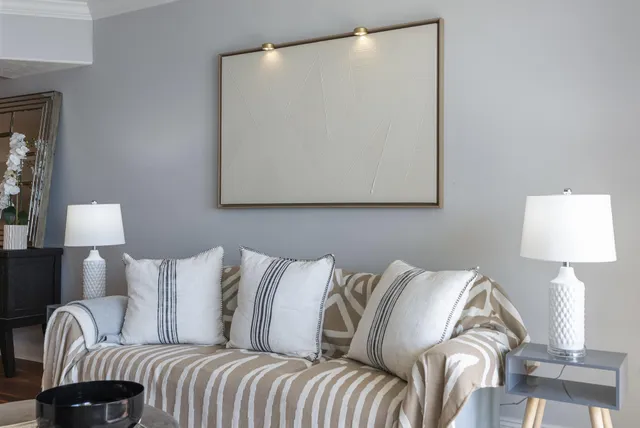 a view of a bedroom with a bed and a window