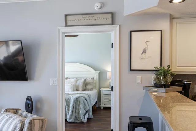 a bedroom with a bed and a table in it