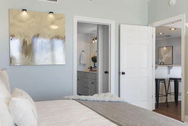 a bed sitting in a bedroom next to a window