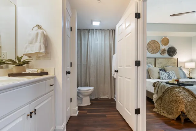 a balcony with wooden floor outdoor seating and city view