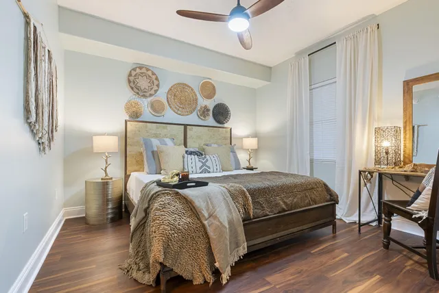 a large kitchen with cabinets stainless steel appliances and a counter space