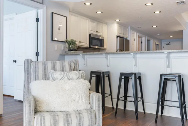 a bedroom with a bed and a lamp