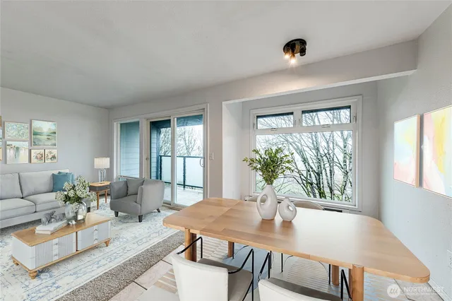 a view of a dining room with furniture window and outside view