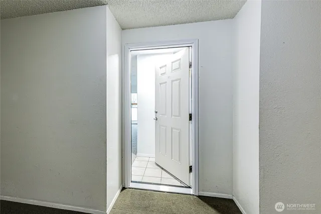 a view of washer and dryer with bathroom in it