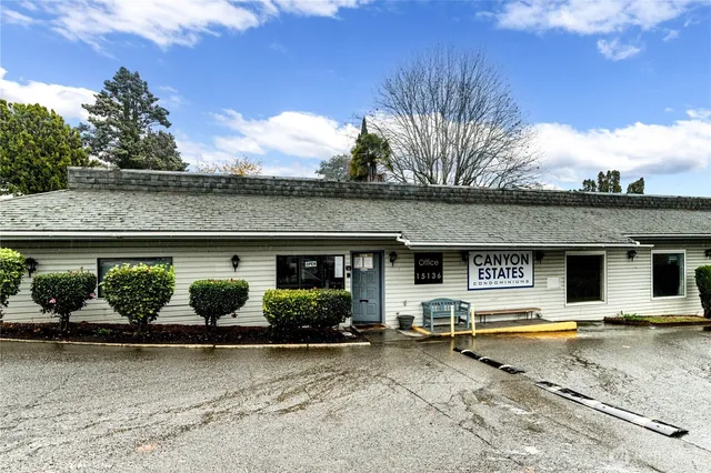 a view of a wooden door with a bench