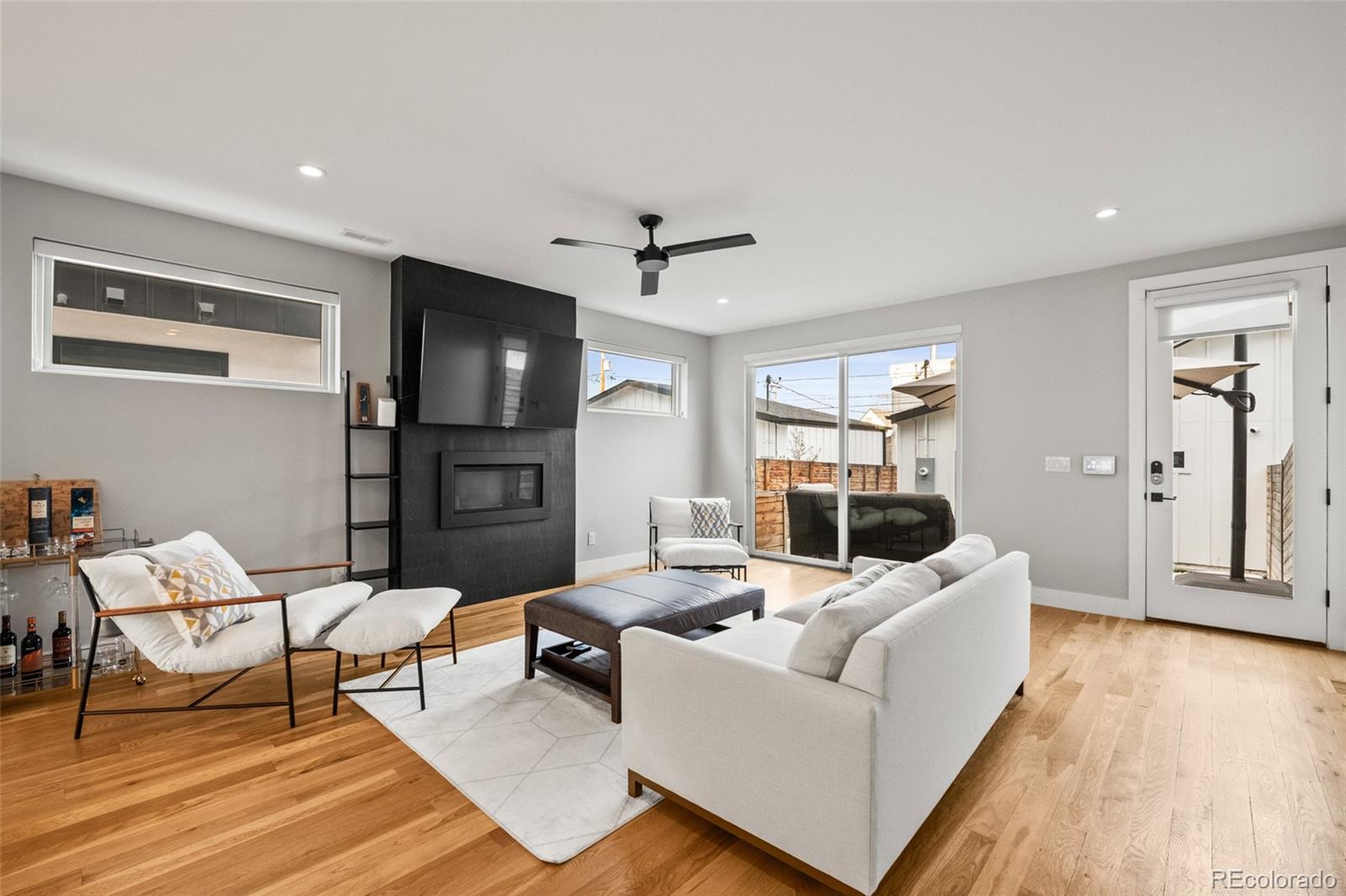 3612 Vallejo Street Denver, CO 80211 - Photo 11 of 50 a living room with furniture and a flat screen tv