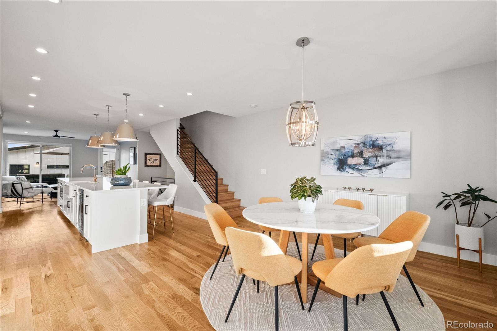 3612 Vallejo Street Denver, CO 80211 - Photo 14 of 50 a dining room with furniture and wooden floor