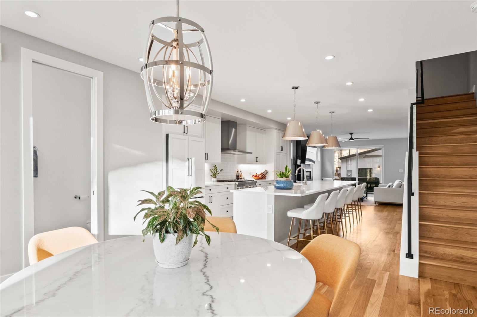 3612 Vallejo Street Denver, CO 80211 - Photo 15 of 50 a dining room with furniture and a chandelier