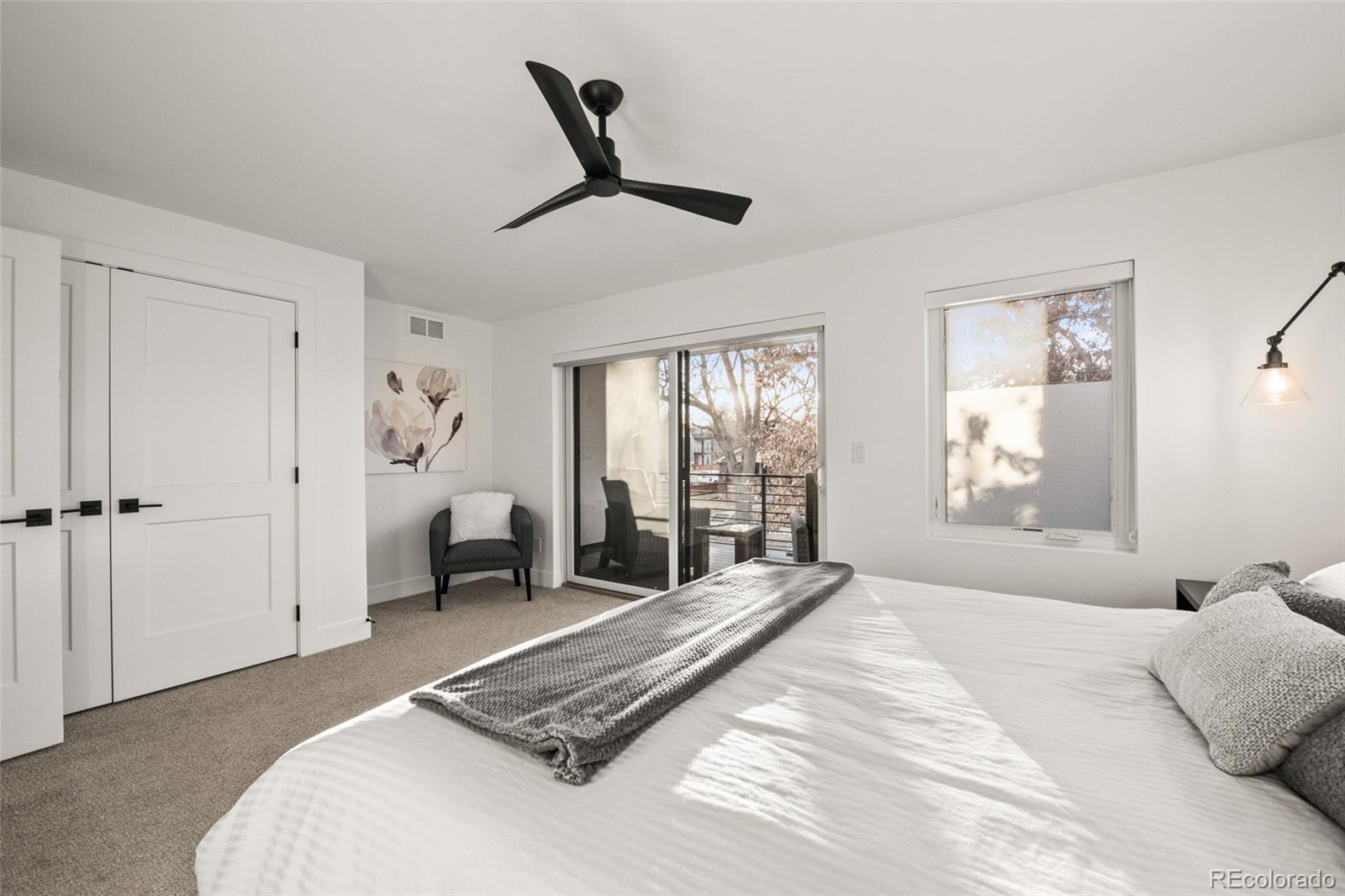 3612 Vallejo Street Denver, CO 80211 - Photo 19 of 50 a spacious bedroom with a large bed and a window