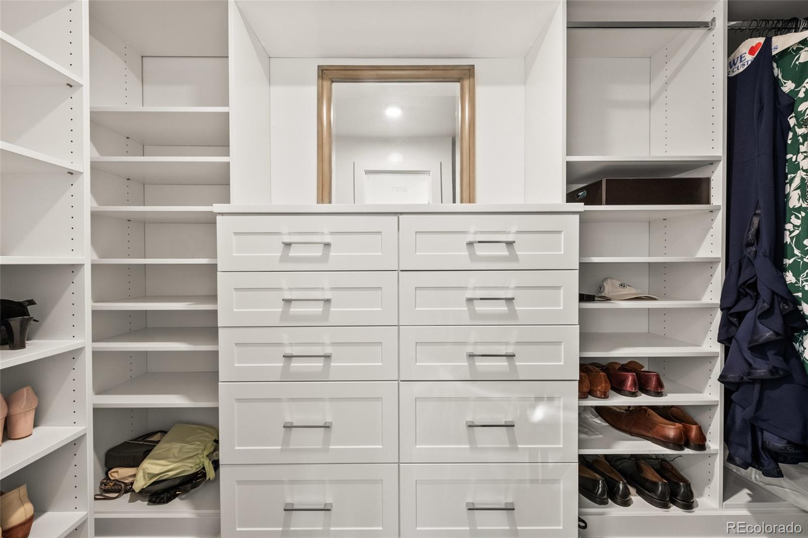 3612 Vallejo Street Denver, CO 80211 - Photo 23 of 50 a view of walk in closet with clothes and shoes