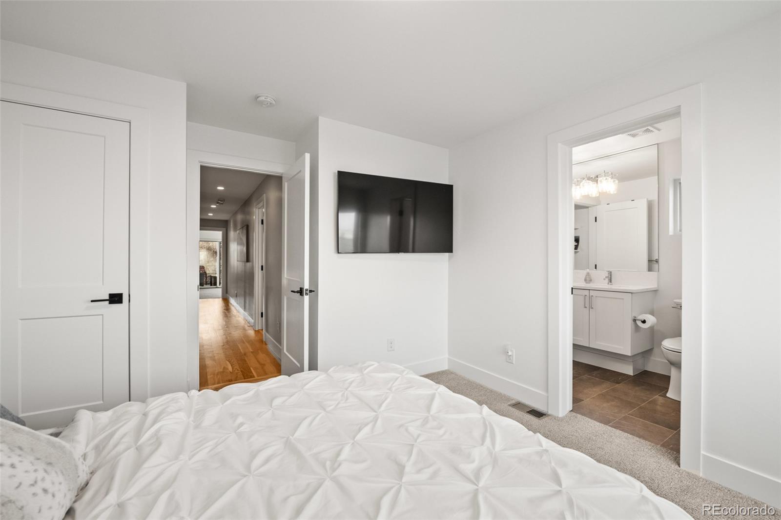 3612 Vallejo Street Denver, CO 80211 - Photo 25 of 50 a bedroom with a bed and a view of bathroom