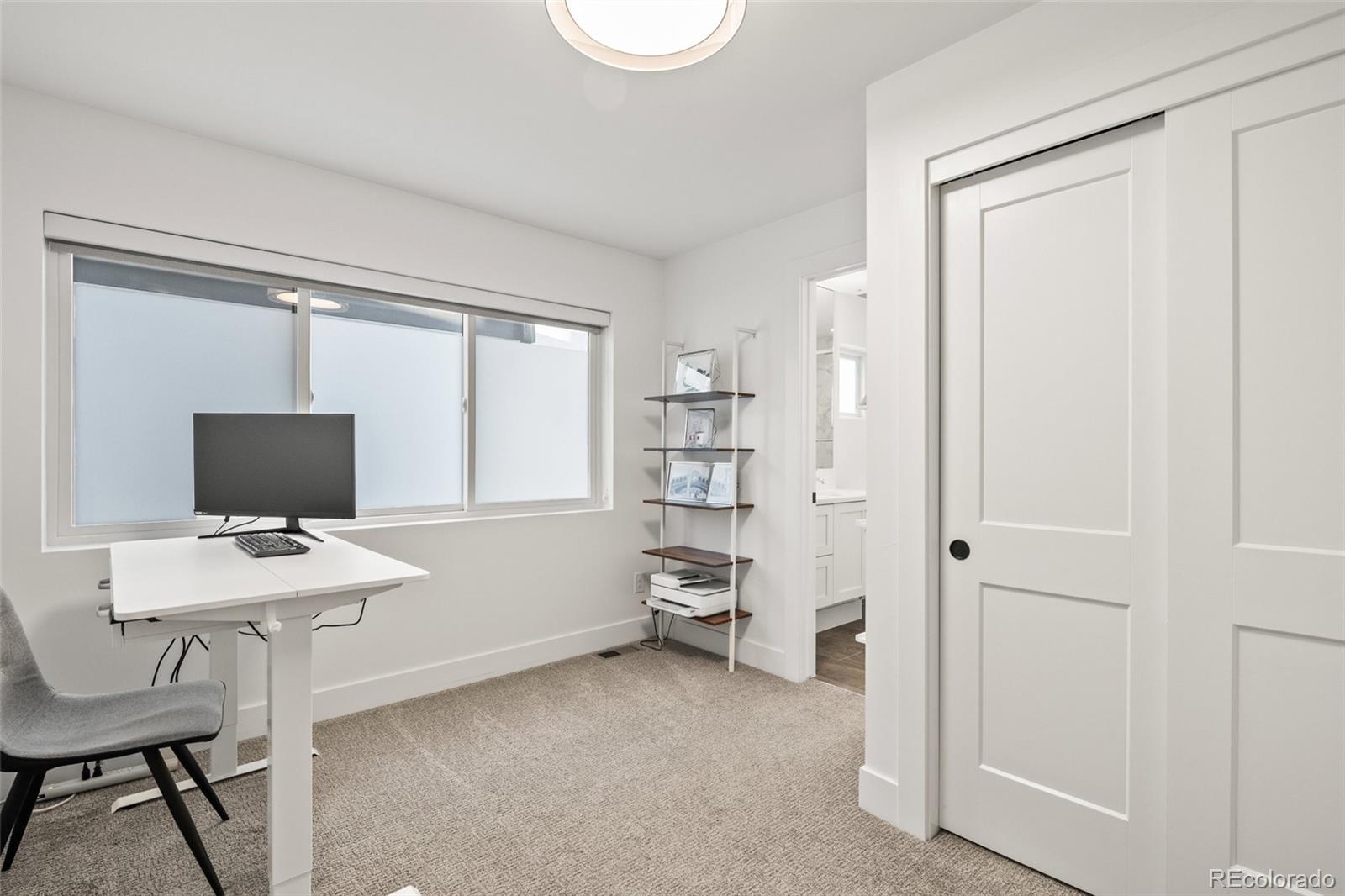 3612 Vallejo Street Denver, CO 80211 - Photo 29 of 50 a view of a workspace with furniture and a window
