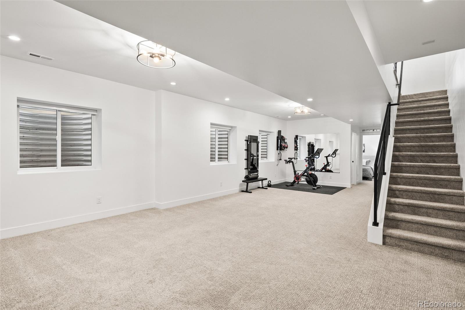 3612 Vallejo Street Denver, CO 80211 - Photo 36 of 50 an empty room with white walls and stairs