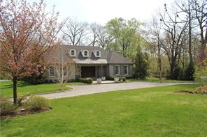 119 Sterling Road Harrison, NY 10528 - Photo 1 of 1 a front view of a house with garden and tree