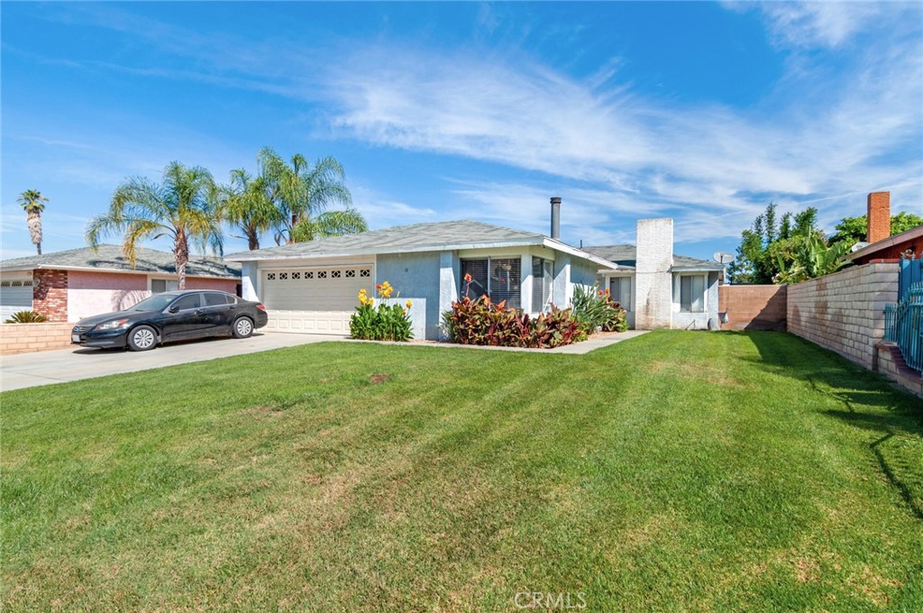 11761 Independence Street Riverside, CA 92503 - Photo 1 of 1 a front view of a house with garden