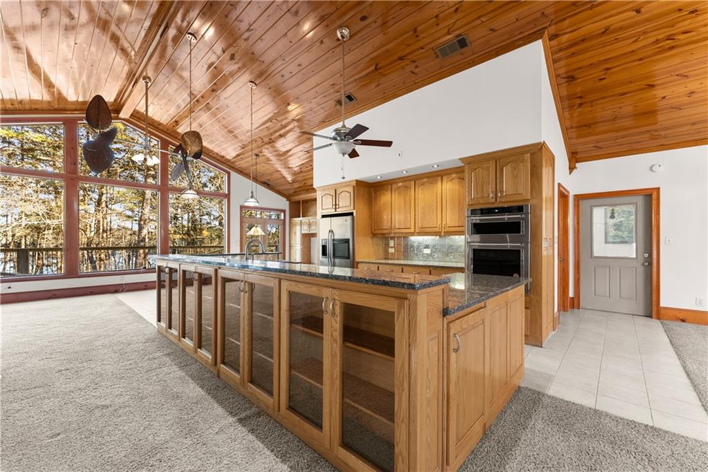 287 Spring Branch Circle Toccoa, GA 30577 - Photo 14 of 75 a kitchen that has a lot of cabinets and wooden floor