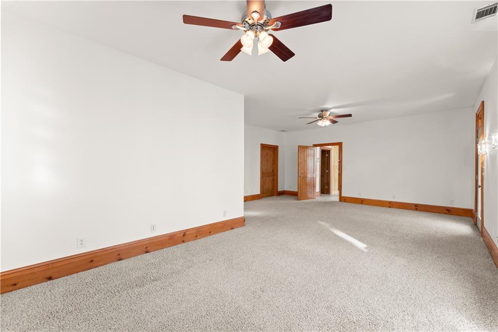 287 Spring Branch Circle Toccoa, GA 30577 - Photo 31 of 75 an empty room with chandelier fan and windows
