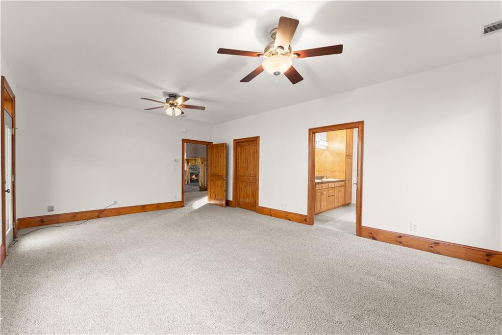 287 Spring Branch Circle Toccoa, GA 30577 - Photo 37 of 75 an empty room with ceiling fan and window