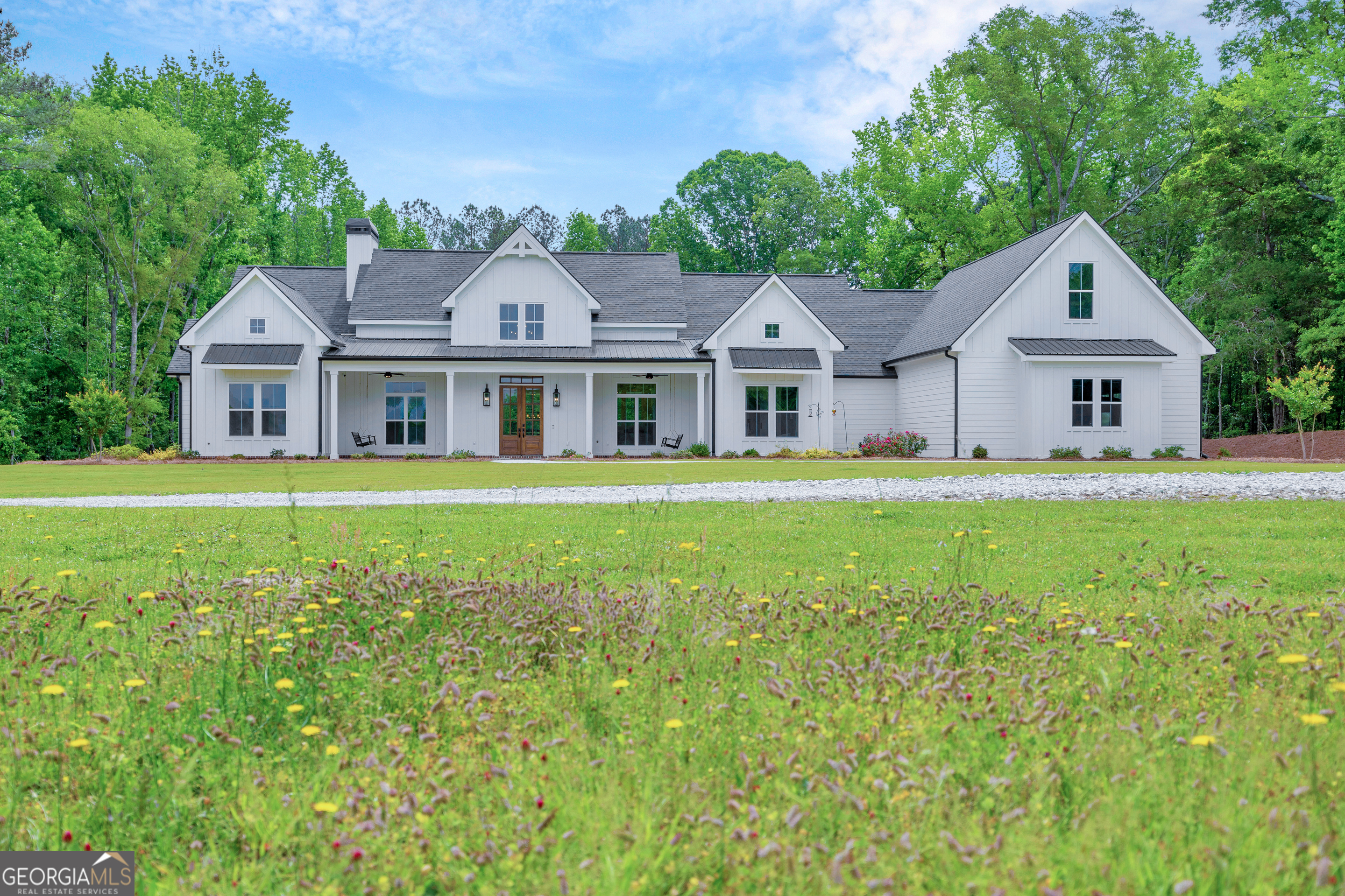 590 Sardis Road Rayle, GA 30660 - Photo 1 of 1 a view of a house with a big yard and large trees
