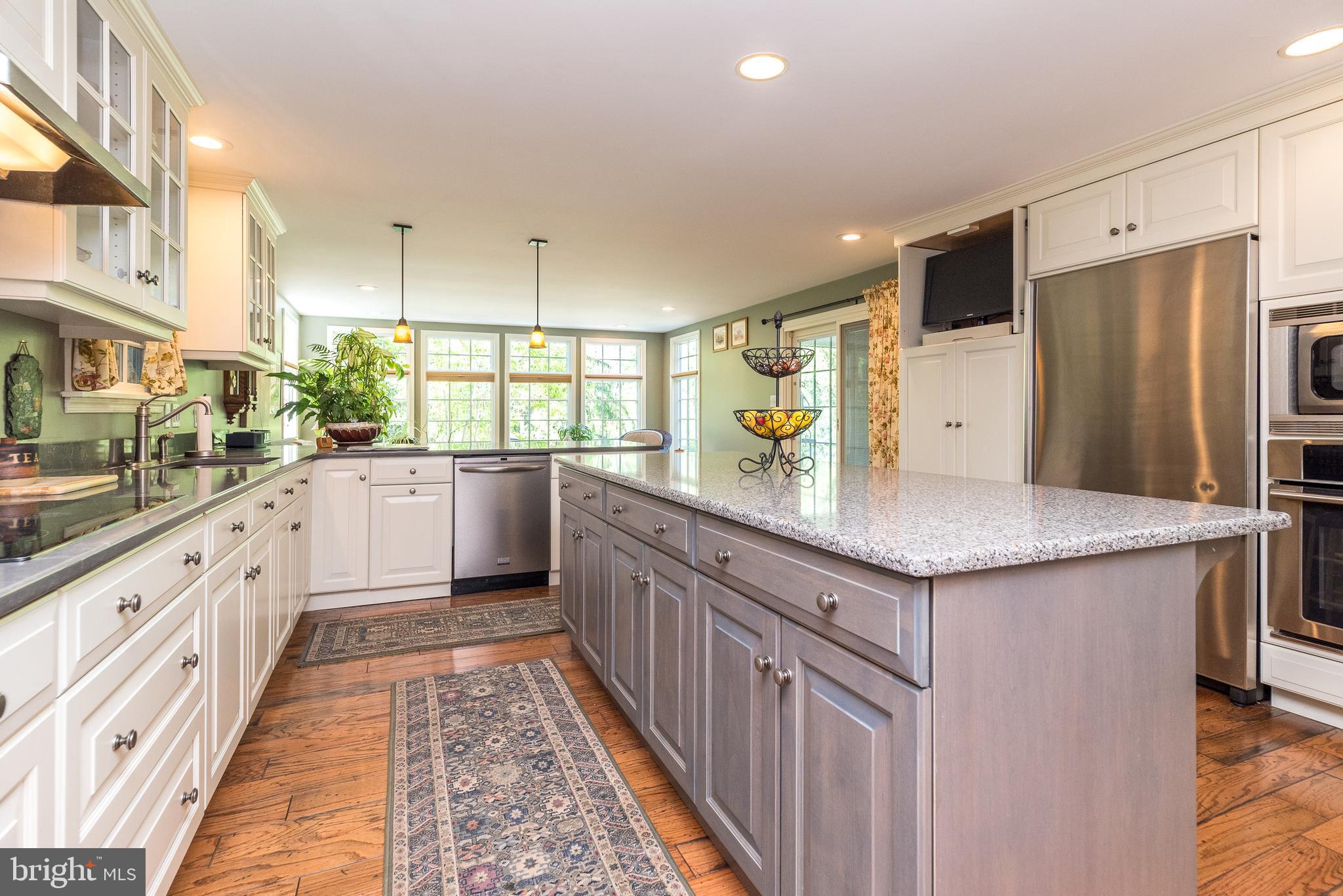 140 Short Road Doylestown, PA 18901 - Photo 17 of 34 a kitchen with stainless steel appliances a sink and a refrigerator