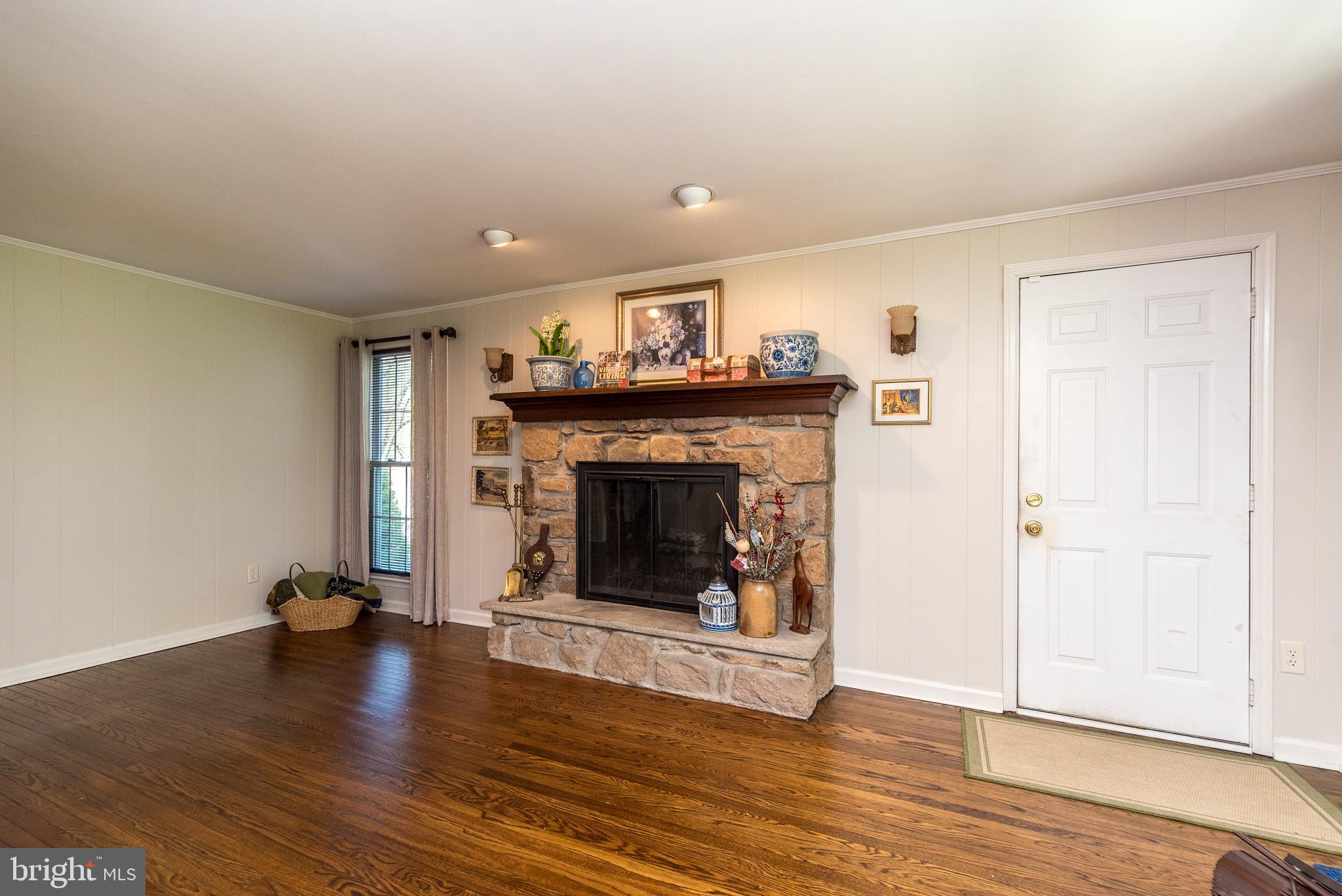 140 Short Road Doylestown, PA 18901 - Photo 19 of 34 a living room with wooden floors and a fireplace