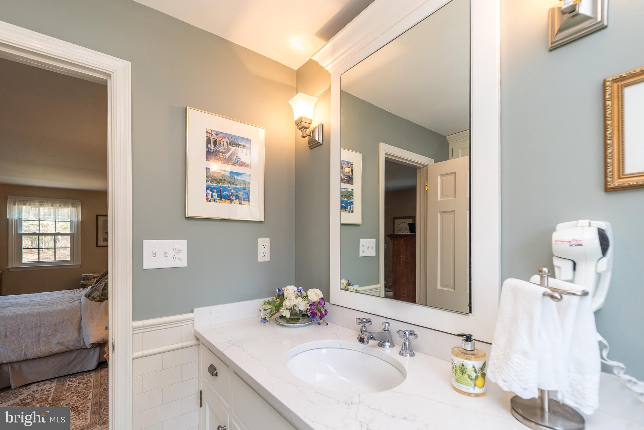 140 Short Road Doylestown, PA 18901 - Photo 23 of 34 a bathroom with a sink and a mirror