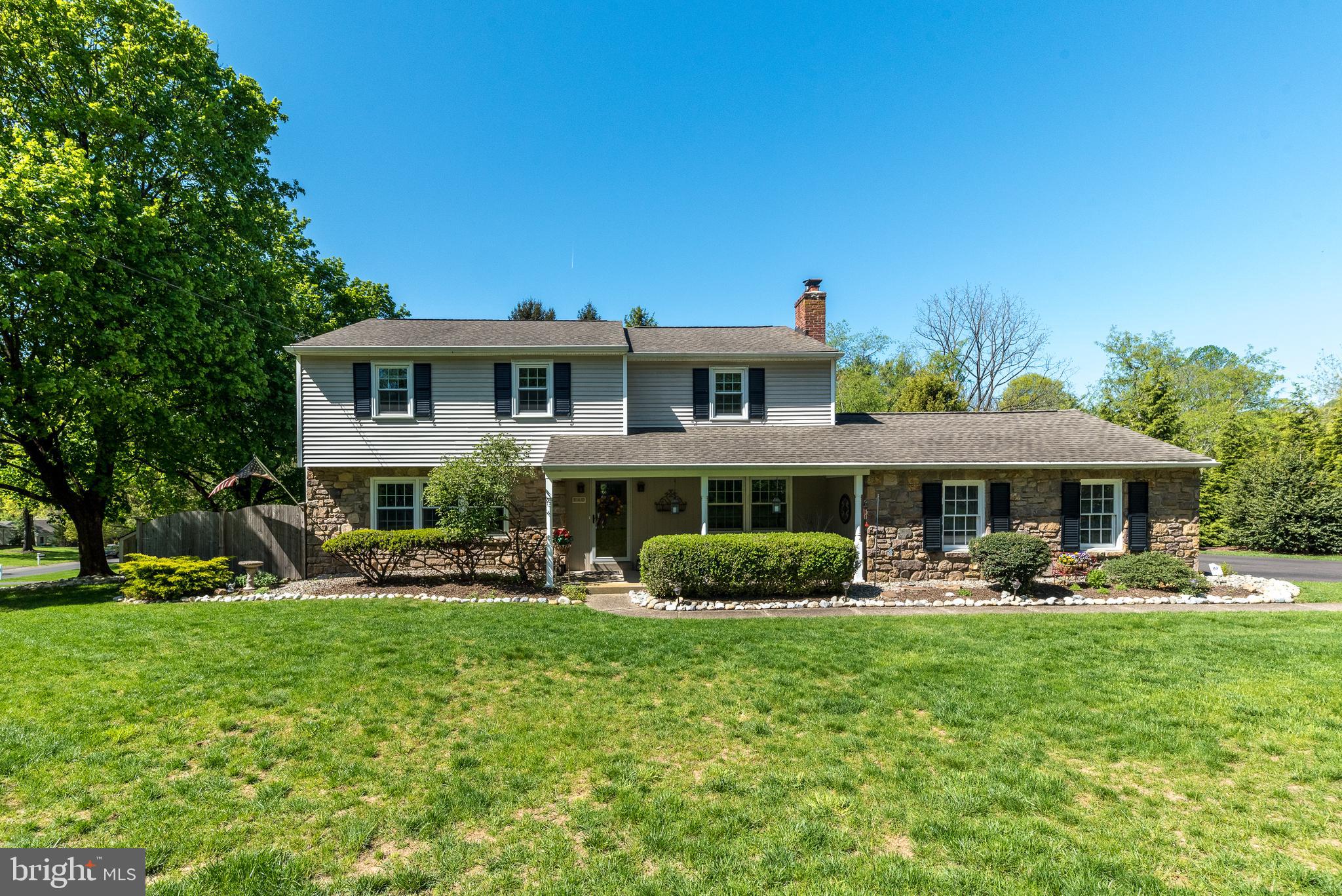 140 Short Road Doylestown, PA 18901 - Photo 3 of 34 a front view of a house with garden and trees