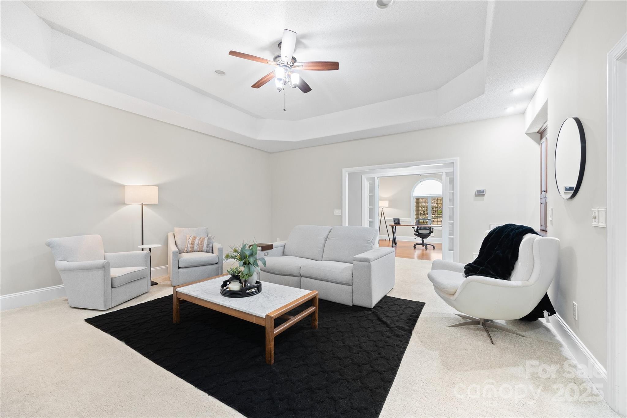 3559 Nestling Lane Fort Mill, SC 29708 - Photo 11 of 42 a living room with furniture a rug and a chandelier