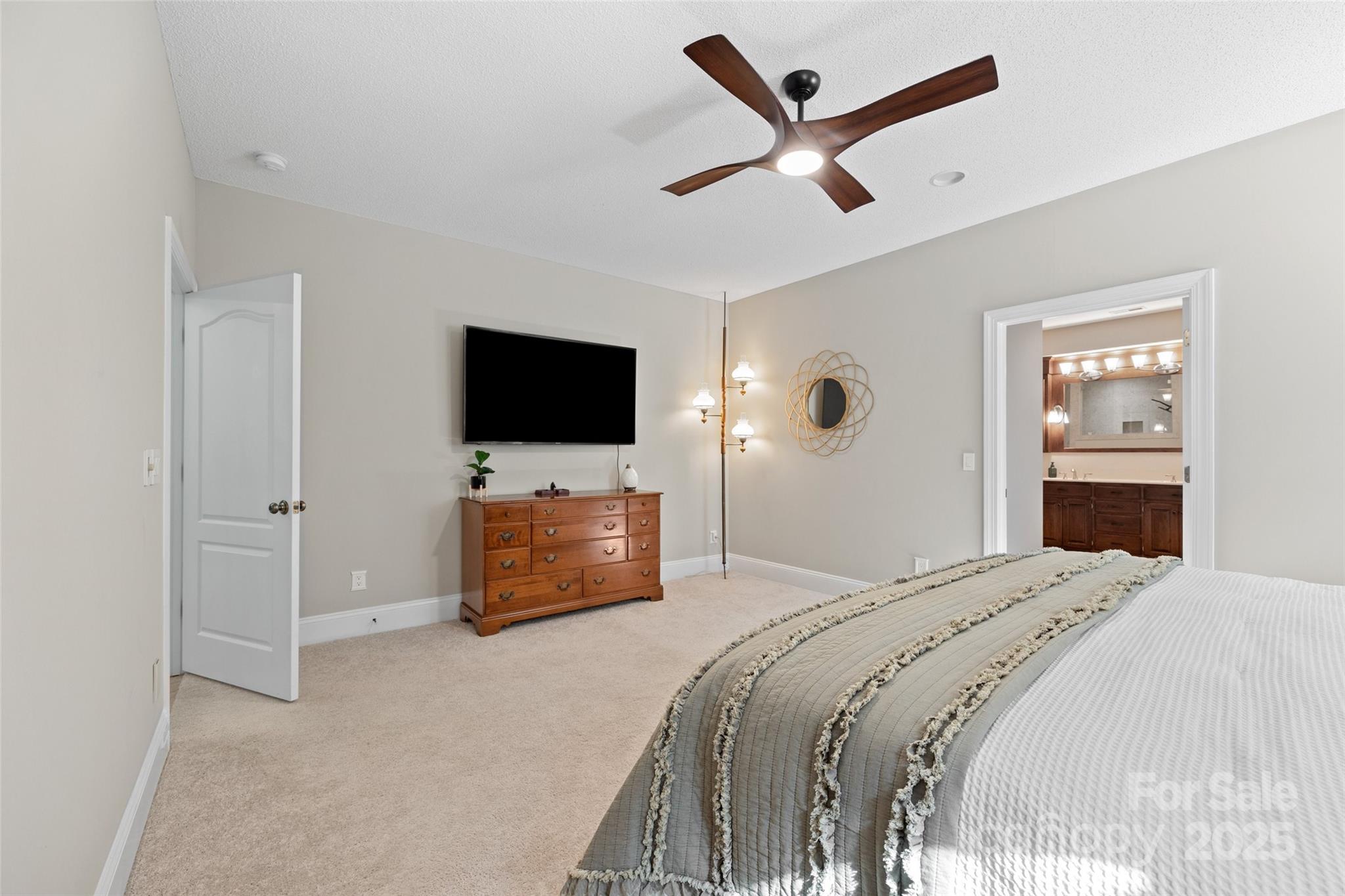 3559 Nestling Lane Fort Mill, SC 29708 - Photo 15 of 42 a bedroom with a bed and a flat screen tv