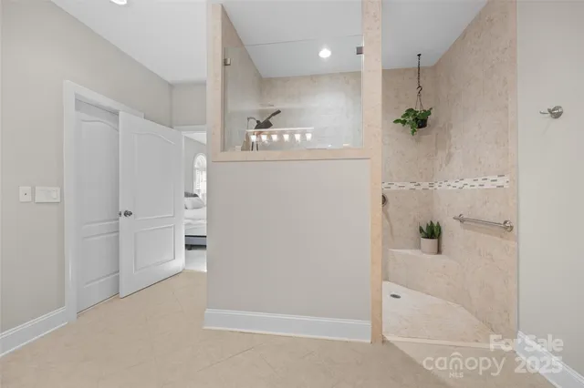 a bathroom with a bathtub and a shower