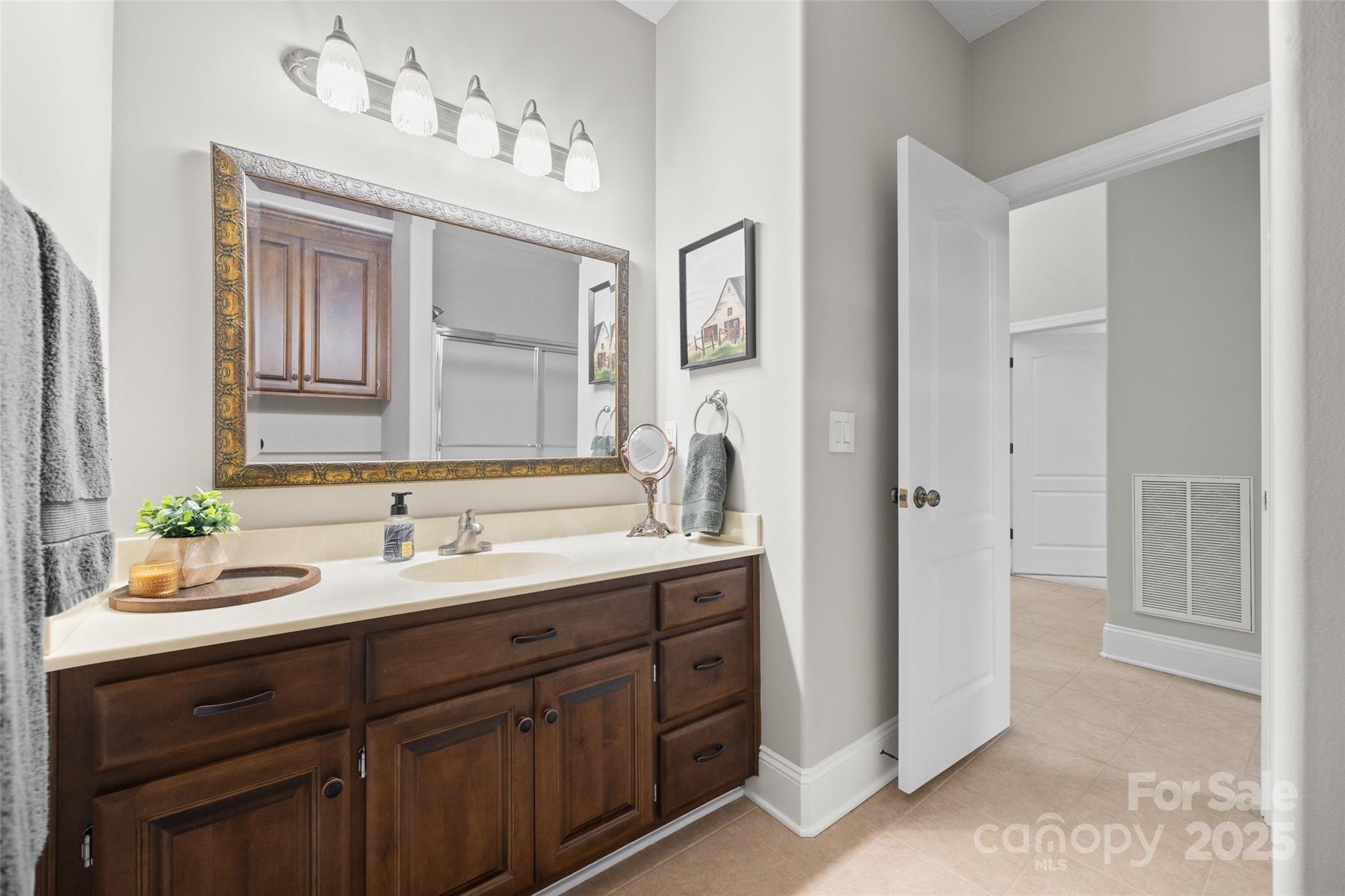 3559 Nestling Lane Fort Mill, SC 29708 - Photo 21 of 42 a bathroom with a sink and a mirror