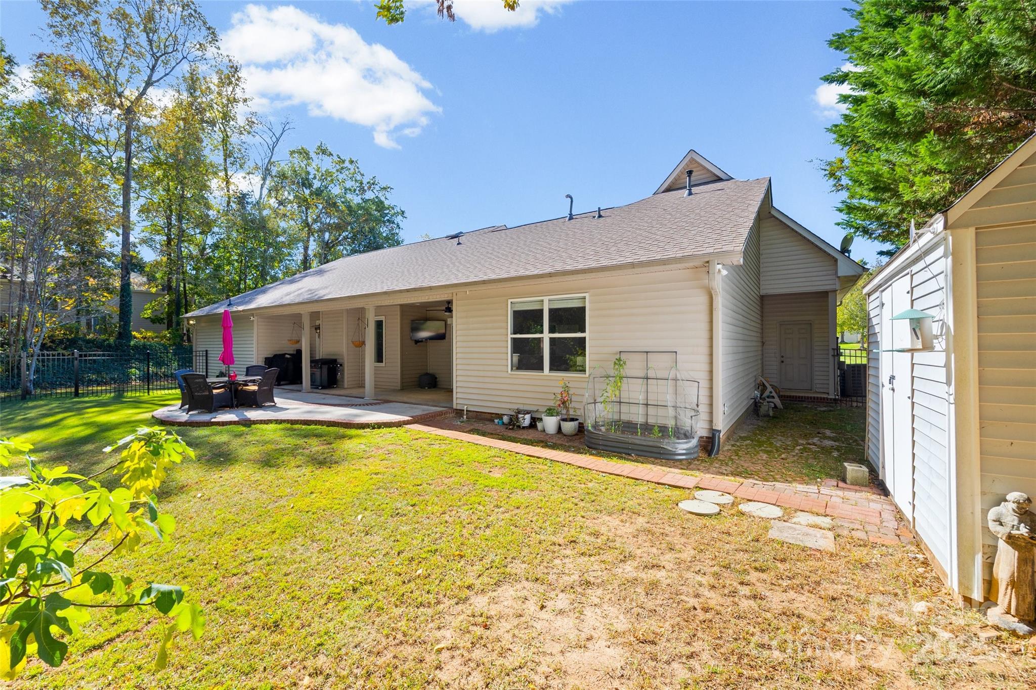 3559 Nestling Lane Fort Mill, SC 29708 - Photo 35 of 42 a view of a house with swimming pool and a yard