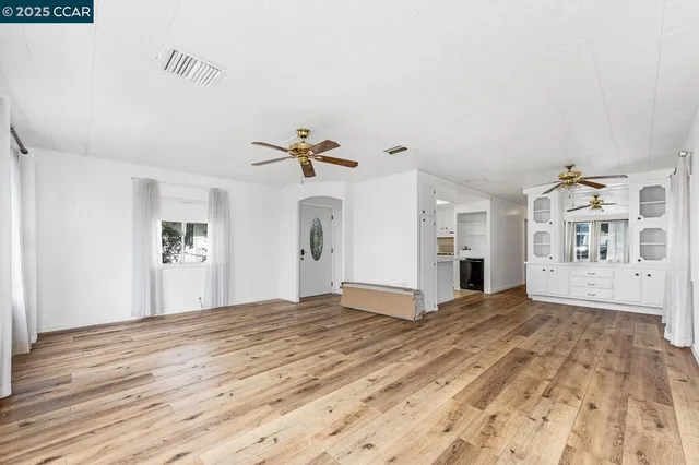 a view of kitchen with cabinets and wooden floor