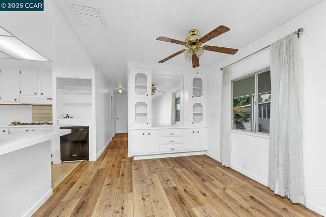 a kitchen with stainless steel appliances a refrigerator and cabinets