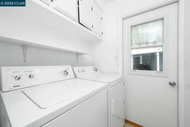a view of a big room with wooden floor and a ceiling fan