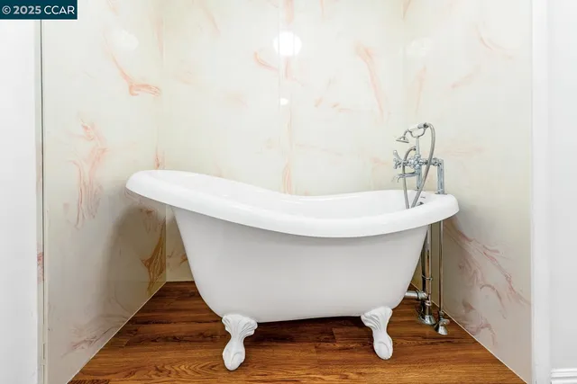 a bathroom with a granite countertop sink mirror and shower
