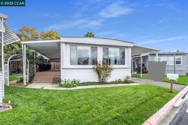 a sign that is sitting on a bench in front of door