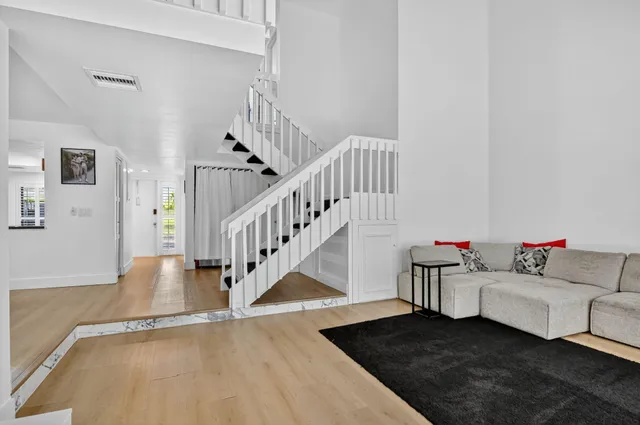 a view of a living room and dining room