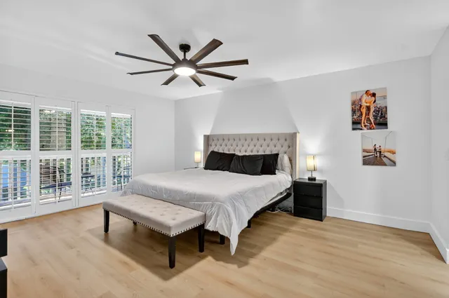 a view of a chairs and table in the balcony