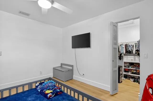a view of a backyard with table and chairs and a slide