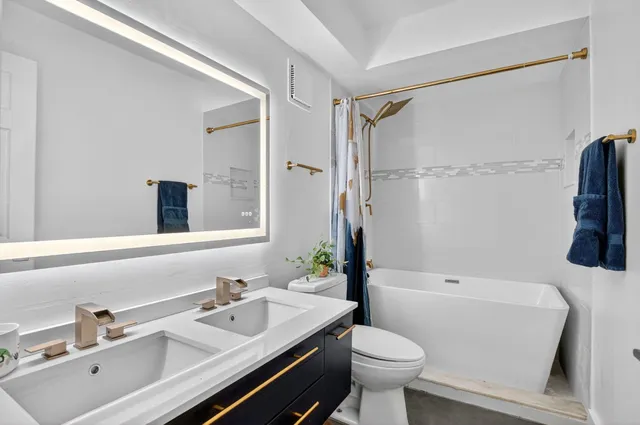 a view of a house with backyard porch and sitting area