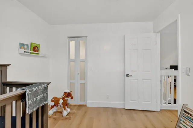 a view of house with a yard and sitting area