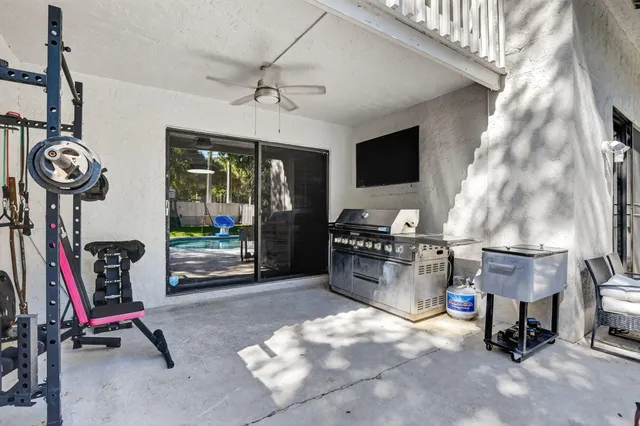 an aerial view of a house with swimming pool garden and patio