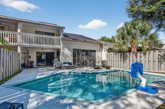 an aerial view of a houses with a lake view