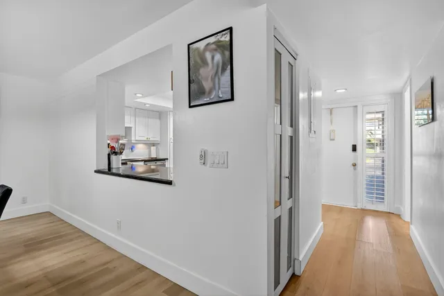 a living room with fireplace furniture and a wooden floor