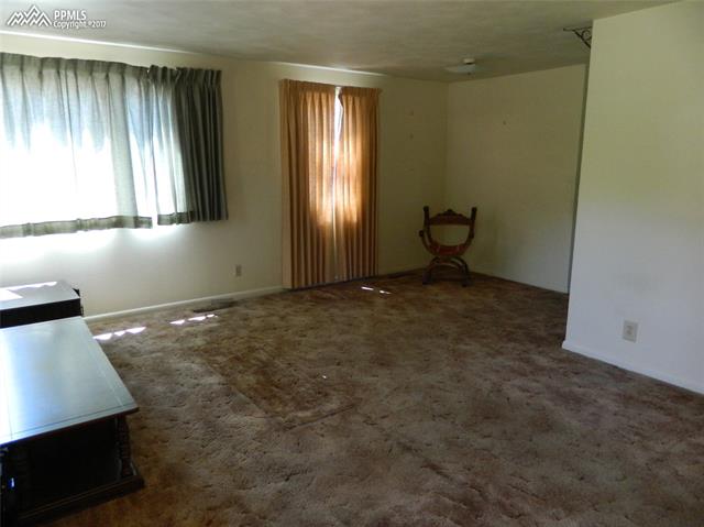 1928 Winston Road Colorado Springs, CO 80909 - Photo 4 of 16 View of dining area from front door.