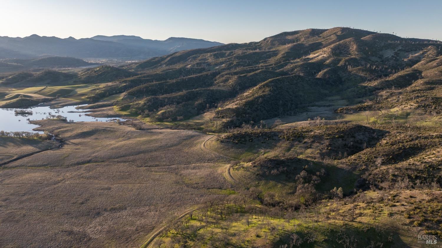 2950 Barnett Road Pope Valley, CA 94567 - Photo 17 of 30 a view of a mountain with a field