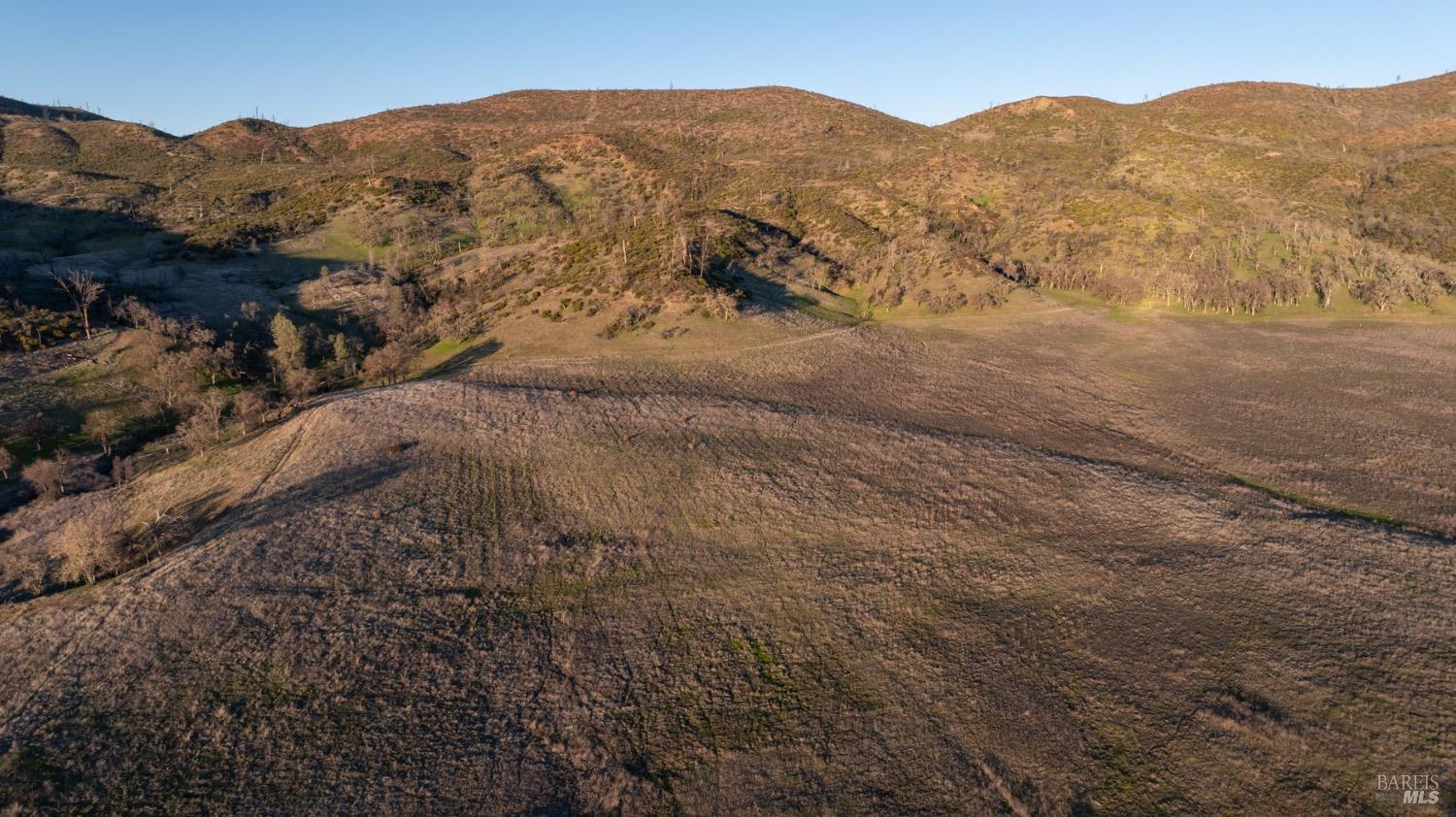 2950 Barnett Road Pope Valley, CA 94567 - Photo 24 of 30 a view of a mountain in the distance in a field