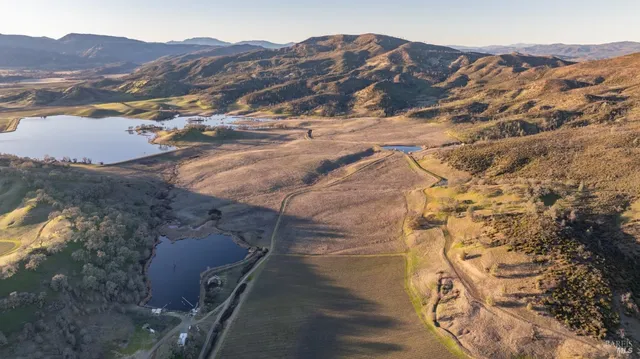 a view of balcony with a table and chairs