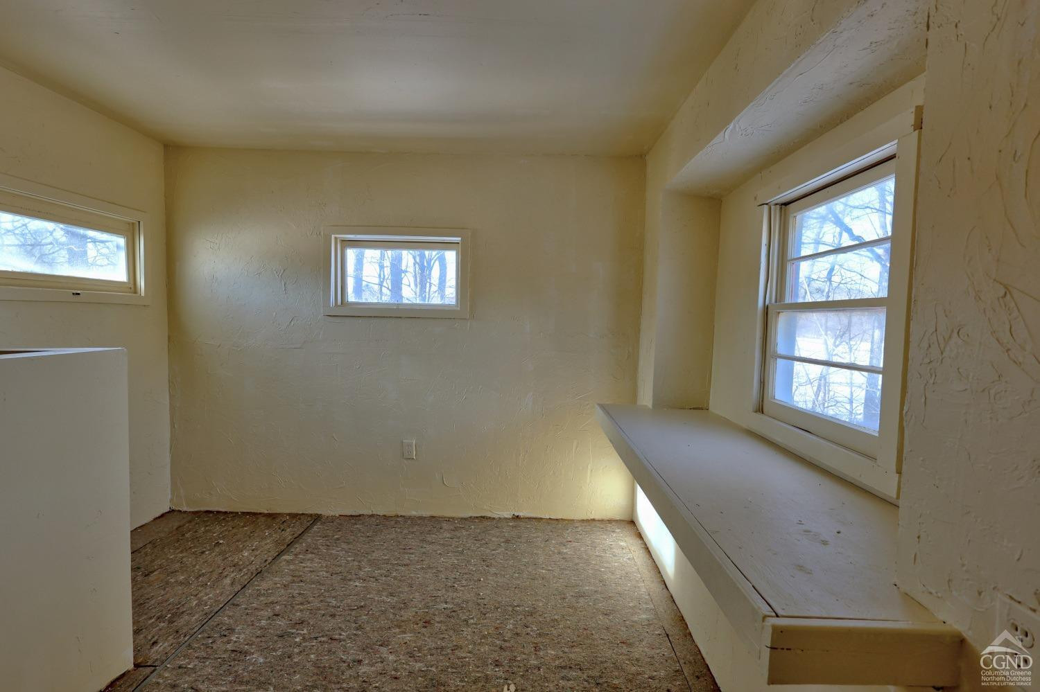 360 Stone Bridge Rd Extension East Durham, NY 12423 - Photo 51 of 83 a view of an empty room and window